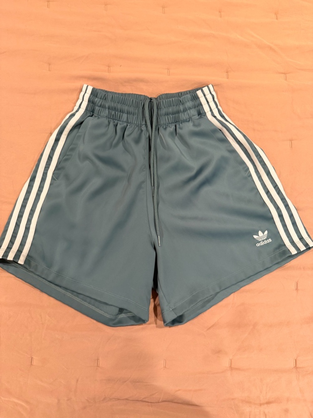 Adidas teal shorts with white stripes & pockets
